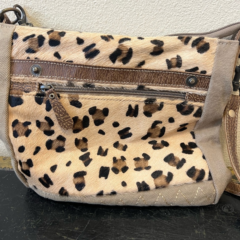 Myra Leather and leopard hair crossbody purse.